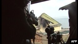 Russian counterterror special forces aim weapons at a target during a military operation in the village of Komsomolskoe, in Daghestan. (file photo)