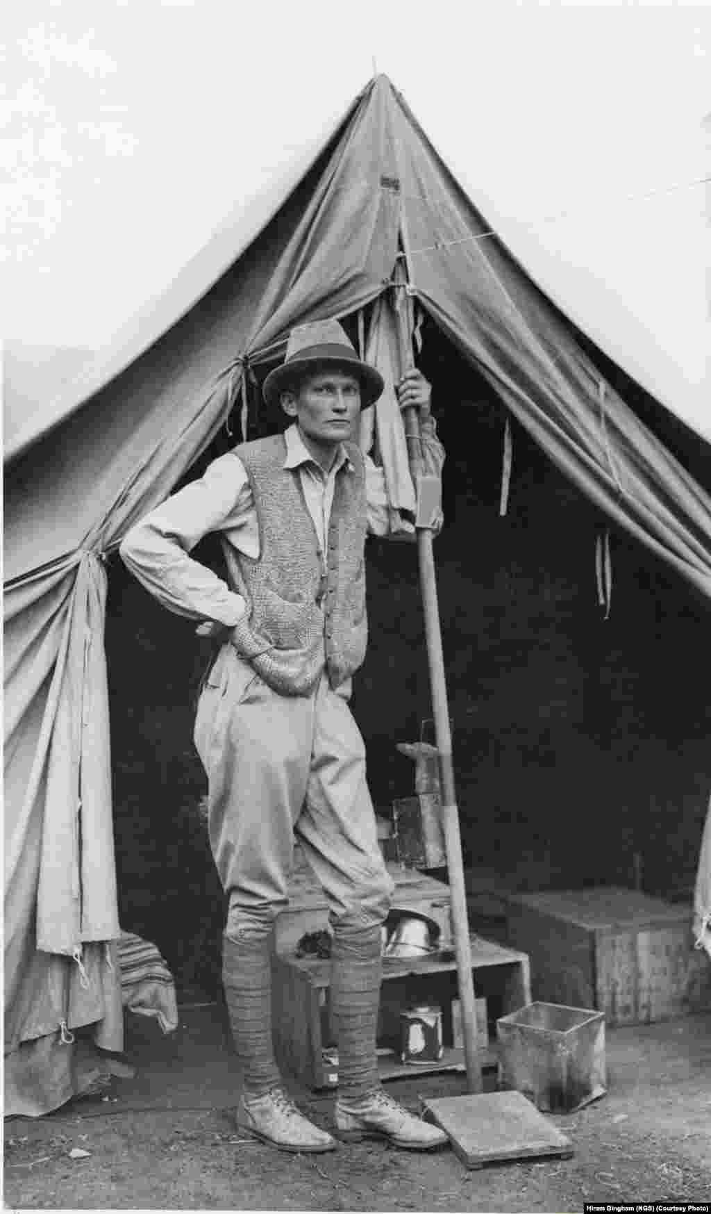 Hiram Bingham poses for an informal picture in front of his tent at Machu Picchu, the lost mountaintop city of the Inca in the Peruvian Andes. National Geographic supported Bingham&rsquo;s excavations at the site from 1912 to 1915.