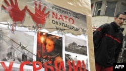 A poster in Belgrade marks the 10th anniversary of the NATO bombing campaign against Serbia.