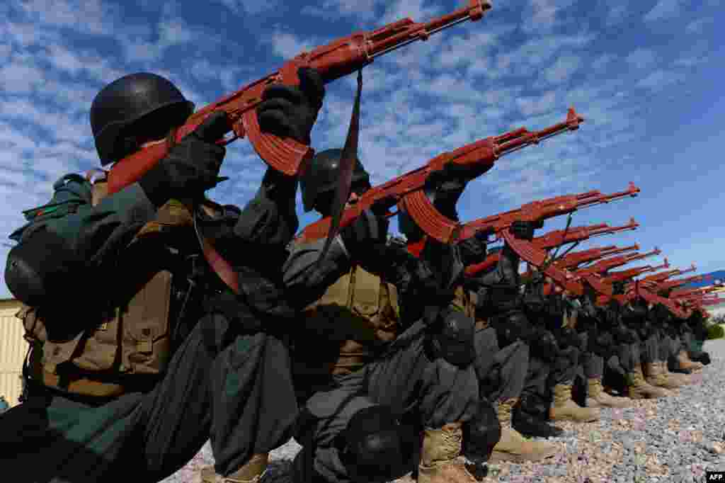 Afghan policemen perform a drill during exercises at a police training centre in Herat on January 27. (AFP/​Aref Karimi)