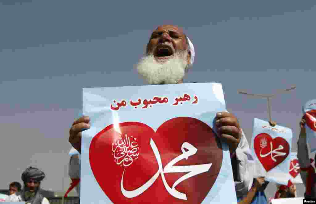 An Afghan protester shouts while holding a sign during a peaceful demonstration in Kabul on September 20. (Reuters/Mohammad Ismail)