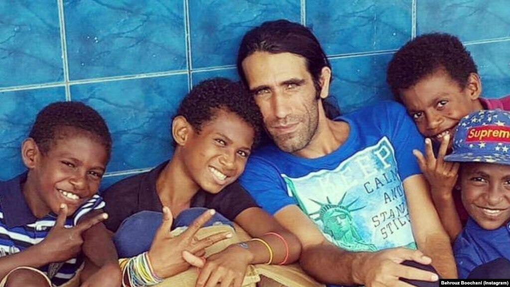 Behrouz Boochani (center right)