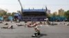 This picture taken on September 22, 2018 in the southwestern Iranian city of Ahvaz shows soldiers lying on the ground at the scene of an attack on a military parade.