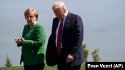 Архивска фотографија: Германската канцеларка Ангела Меркел и американскиот претседател Доналд Трамп