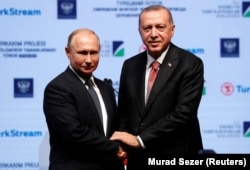 Владимир Путин и Реджеп Эрдоган на церемонии завершения строительства морского участка газопровода "Турецкий поток". Стамбул, 19 ноября 2018 года