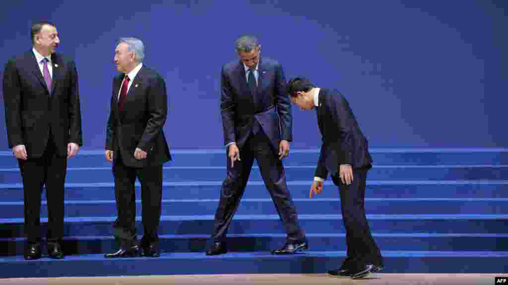 Azerbaijani President Ilham Aliyev, Kazakh President Nursultan Nazarbayev, U.S. President Barack Obama, and South Korean President Lee Myung-bak find their places for the group &quot;family photo&quot; at the 2012 Nuclear Security Summit at the COEX Center in Seoul on March 27. (AFP/Jewel Samad)