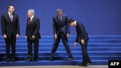 Presidents Ilham Aliyev, Nursultan Nazarbaev, Barack Obama and Lee Myung-Bak find their places for the group photo; 2012 Nuclear Security Summit in Seoul