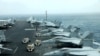 AT SEA -- F/A-18F aircrafts are seen on the deck of USS Abraham Lincoln in the Gulf of Oman near the Strait of Hormuz, July 15, 2019