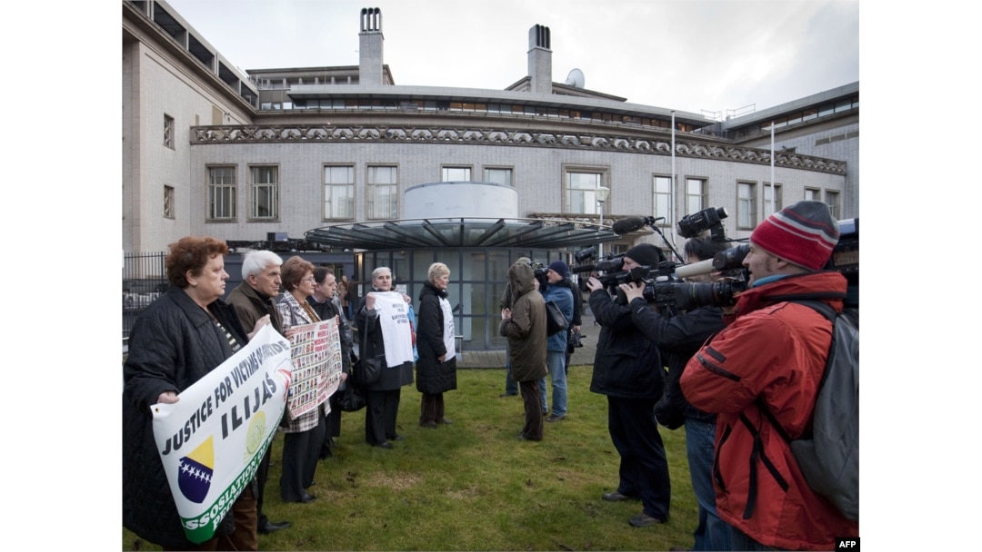 People demonstrate outside the International Criminal Tribunal for the former Yugoslavia in The Hague in March 2010.