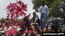 Pakistan Peoples Party (PPP) chairperson Bilawal Bhutto Zardari (C) waves to supporters at the start of his election campaign in the southern province of Sindh.