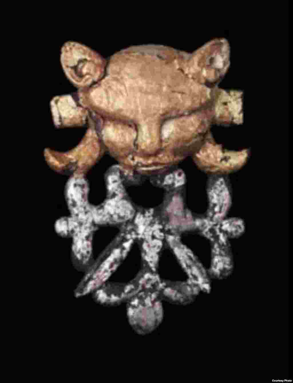 A feline face and stylized ornaments from horse tack, late 4th–early 3rd century B.C. (Presidential Center of Culture, Astana)