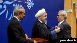Abdolrasoul Dorri Esfahani (right) was honored by President Hassan Rohani on February 8, 2016, for his role in the landmark nuclear negotiations.
