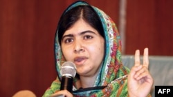 Pakistani education activist Malala Yousafzai gives a press conference after meeting with the Nigerian president in Abuja on July 14.