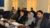FILE: Najibullah Ahmadzai the former chairman of Independent Election Commission (R) during a meeting in Kabul.