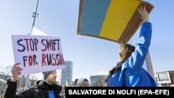 Protesters rally against Russia's full-scale invasion of Ukraine outside the United Nations in Geneva on February 26, 2022. 