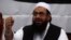 Hafiz Saeed, head of the Jamaat-ud-Dawa organisation and founder of Lashkar-e-Taiba (LET), gestures during a news conference in 2014.