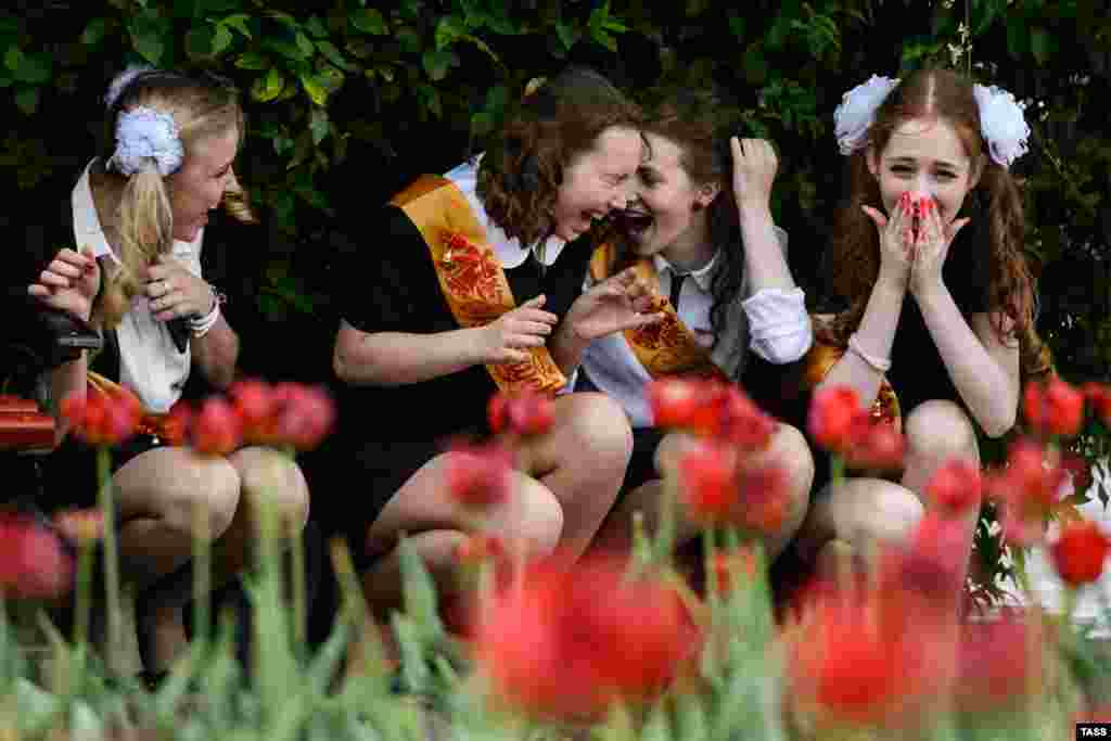 Graduates of a school in Yekaterinberg, Russia, during holiday festivities in honor of the end of the school year on May 24. (TASS/Artur Lebedev)