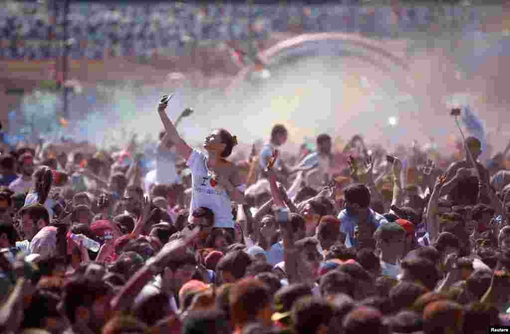 Participants celebrate during the I Love Damascus marathon at Umayyad Square in Damascus. (Reuters/Omar Sanadiki)