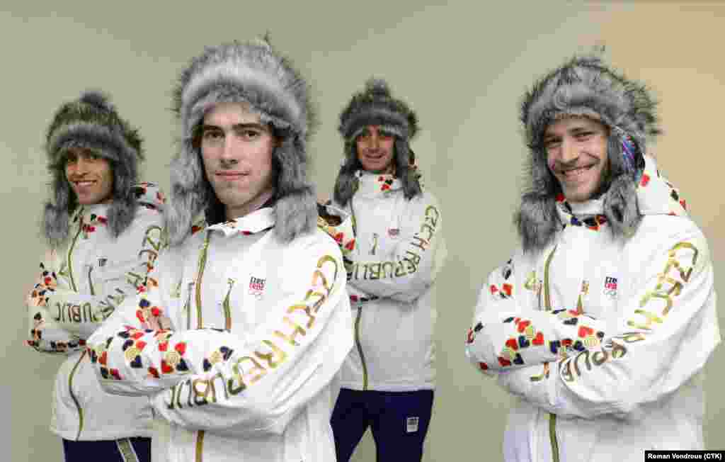 Czech ski jumpers model their Olympic outfits in Prague on January 20, 2014. 