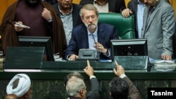 Speaker of Parliament, Ali Larijani, in the impeachment of Iran's labor, Ali Rabiei, 2018. 