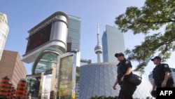 Police patrol the streets ahead of the G20 summit in downtown Toronto.