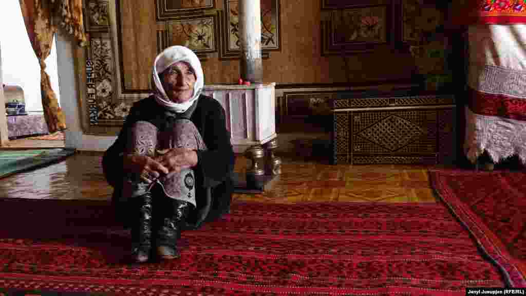 Zamir&#39;s mother, Meyman, in her house. She is one of the first generation of nomads who were settled here by the Soviet government.