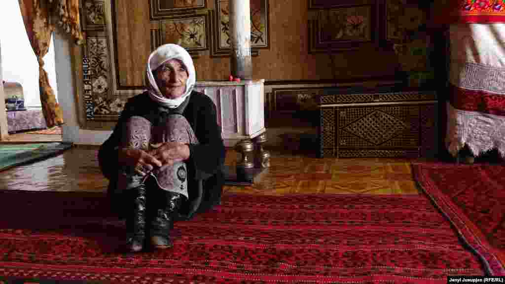 Zamir's mother, Meyman, in her house. She is one of the first generation of nomads who were settled here by the Soviet government.