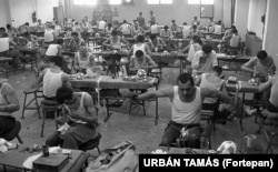 Prisoners stitching footballs in a prison in Marianosztra in northern Hungary in 1987. Although state persecution had relaxed since the 1950s, monitoring of citizens seen as a threat to communist rule in Hungary continued through the 1980s.