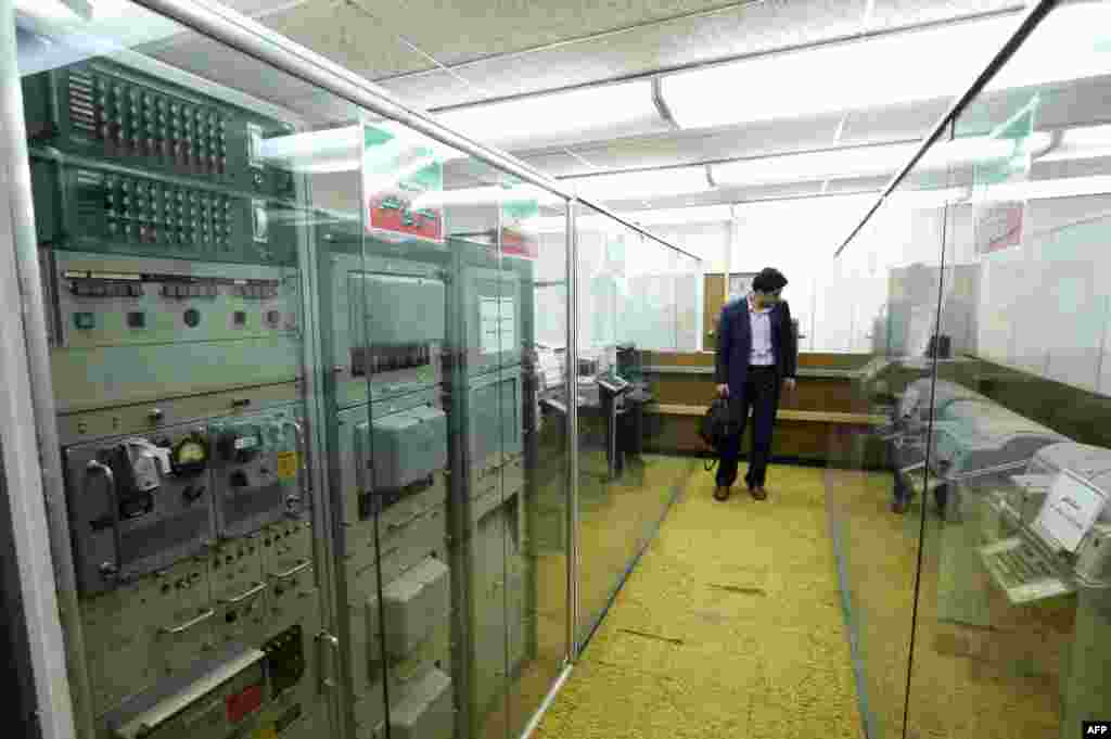A man visits the former American embassy now turned into a museum in Tehran