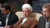 Ex-President Ali Akbar Hashemi Rafsanjani is flanked by current President Mahmud Ahmadinejad (left) and parliament speaker Ali Larijani (right).