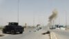 Smoke rises from a bomb attack in clashes between Iraqi security forces and Islamic State militants on the outskirts of Ramadi on April 9.
