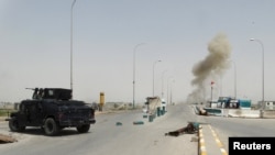 Smoke rises from a bomb attack in clashes between Iraqi security forces and Islamic State militants on the outskirts of Ramadi on April 9.