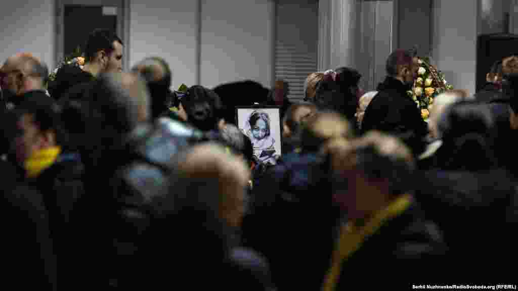 A portrait of Kateryna Statnik is seen at the service. Kateryna, 27, was a senior flight attendant and worked at Ukraine International Airlines for seven years.