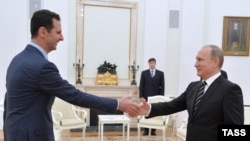 Президент Сирії Башар Асад (л) і президент Росії Володимир Путін
