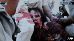 The circumstances surrounding Qaddafi's death in October are still unclear. 