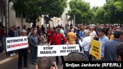 Protesters rally to show their anger at the attack on Montenegrin journalist Olivera Lakic in Podgorica on May 9.