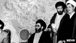 An undated photo probably from early1980s, showing Ali Khamenei (C) and Hashemi Rafsanjani (far R)