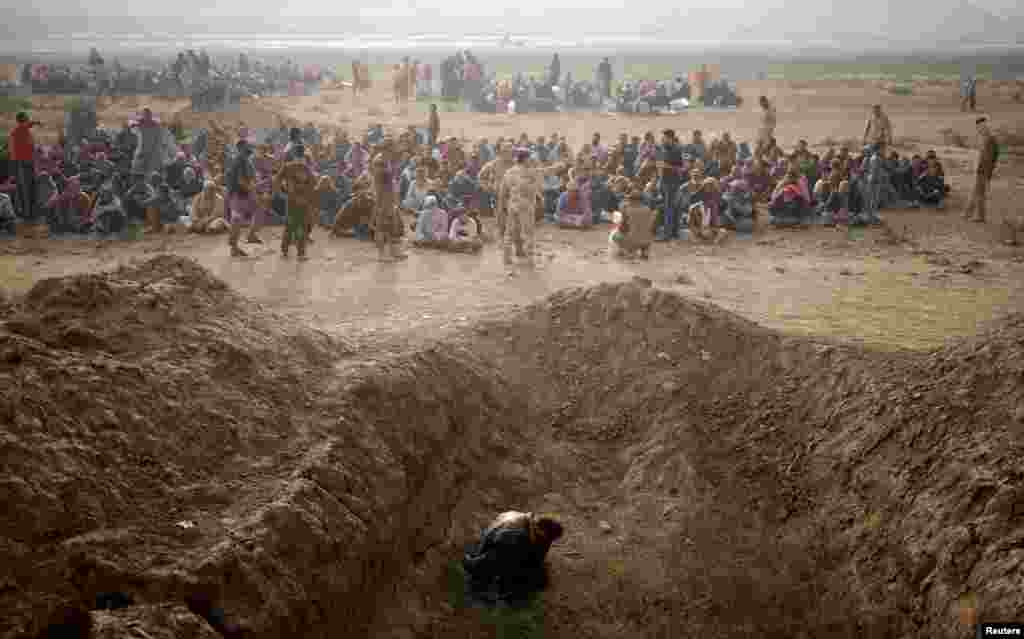 A detained man accused of being an Islamic State fighter is pictured east of Mosul on October 26, 2016. Tomasevic has been photographing conflict since the&nbsp;Yugoslav wars of 1991-2001. The Serbian photographer recalls that during the 90s, the biggest news stories in the world were &quot;at my door, so that&#39;s how I started.&quot;