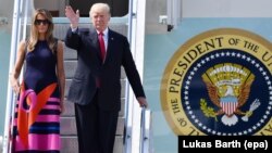 U.S. President Donald Trump (right) and first lady Melania Trump will arrive in France early on July 13.
