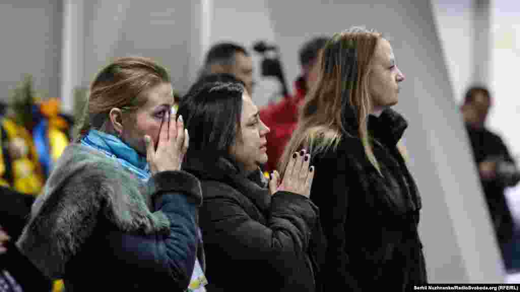 Mourners attend the memorial service.