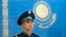 Kazakhstan -- A Kazakh soldier stands in front of the national flag at the presidential palace, in Astana, December 05, 2014