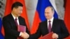 Russian President Vladimir Putin (right) and his Chinese counterpart Xi Jinping got higher ratings in a global poll than U.S. President Donald Trump.