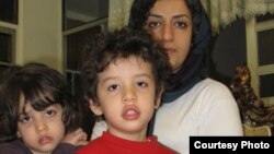 Iranian human rights activist, Narges Mohammadi, (right) with her children, Ali (center) and Kiana. 