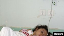 A survivor of a bomb blast in her hospital bed in Mahabad on September 22