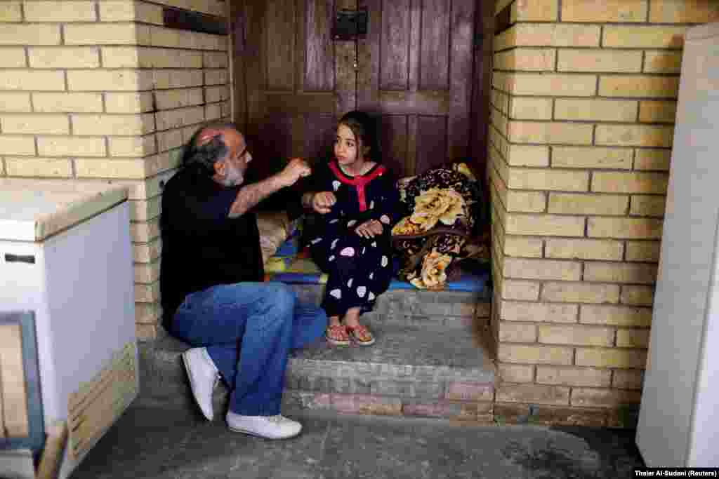 IRAQ - Director Hassan Husni speaks to an Iraqi girl actor to prepare for a scene of the hotel TV series, which is being filmed and broadcast during the Muslim holy month of Ramadan, in Baghdad, Iraq May 12, 2019