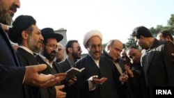 Iranian officials and members of the Jewish community pray together at a ceremony to unveil a monument honoring Iranian-Jewish soldiers who died in action during the Iran-Iraq War of the 1980s.