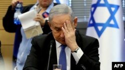 Israeli Prime Minister Benjamin Netanyahu gestures as he speaks during a meeting of the right-wing bloc at the Knesset (Israeli parliament) in Jerusalem on November 20, 2019.