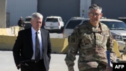 U.S. Lieutenant General Stephen Townsend (right) welcomes U.S. Defense Secretary Jim Mattis to Baghdad in February.