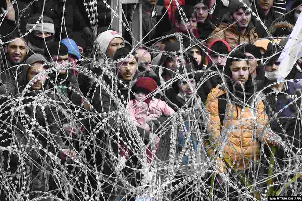 Migrants wait on the Greek-Turkish border near the village Kastanies on March 2.&nbsp;