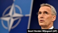 NATO Secretary-General Jens Stoltenberg speaks during a media conference at the alliance's headquarters in Brussels on April 26.